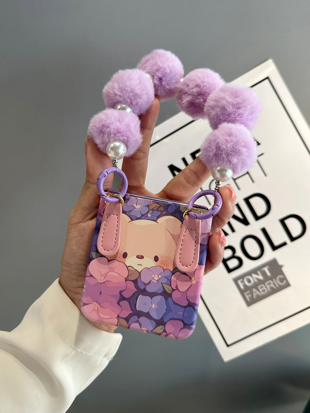 Floral Flip Phone Case with Pom-Pom Strap